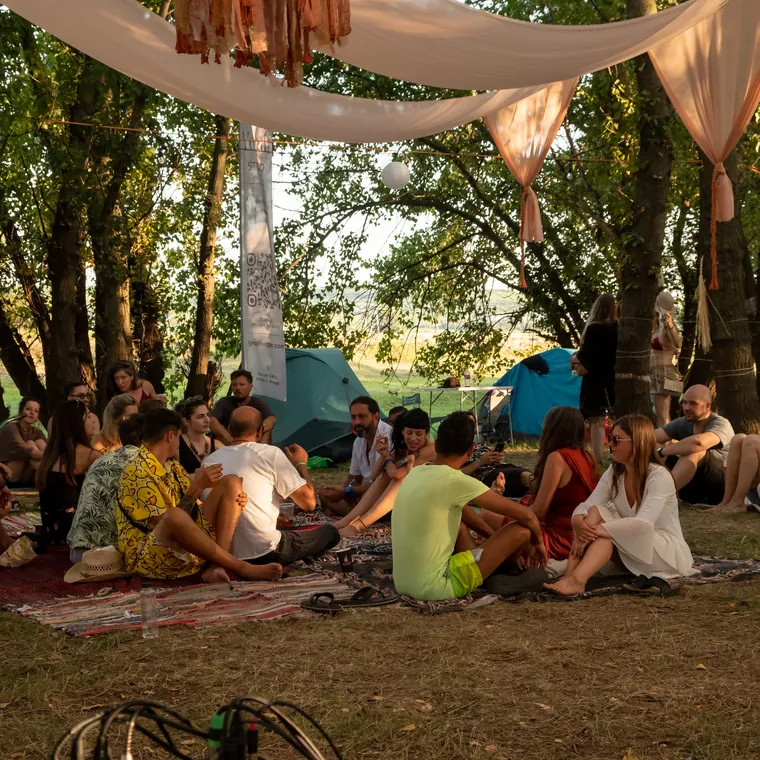 The tribe gathered under the canopy